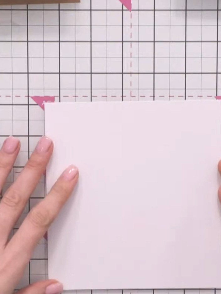 Step 1: Cut a square piece of white card stock for your card base. Position it on your cutting mat with the solid port