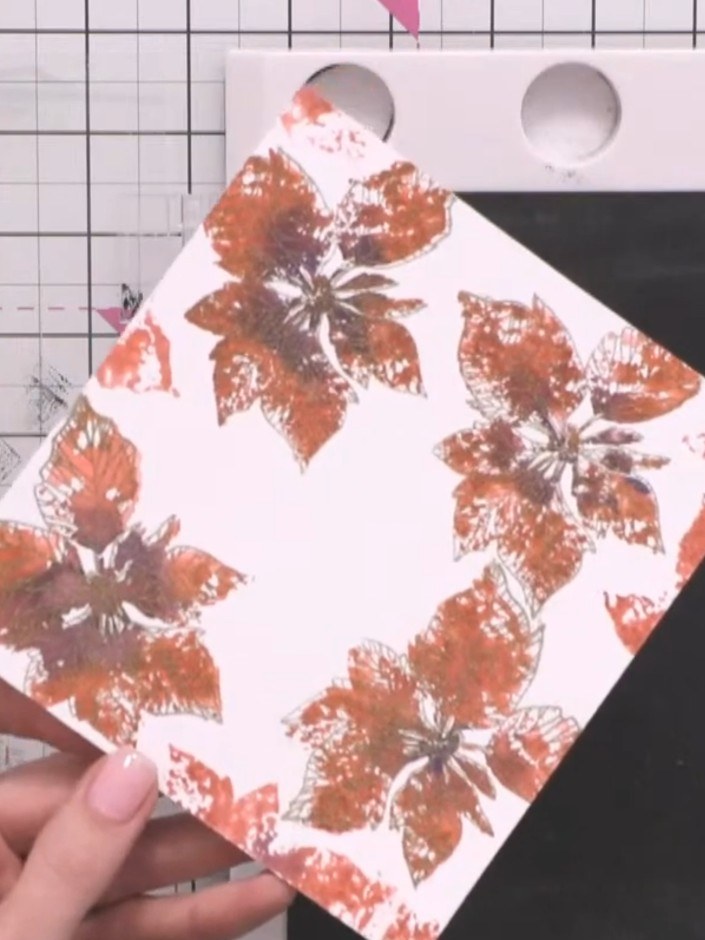 Step 12: Heat set the embossed detail with a heat gun, holding it over the card until the embossing powder melts and se