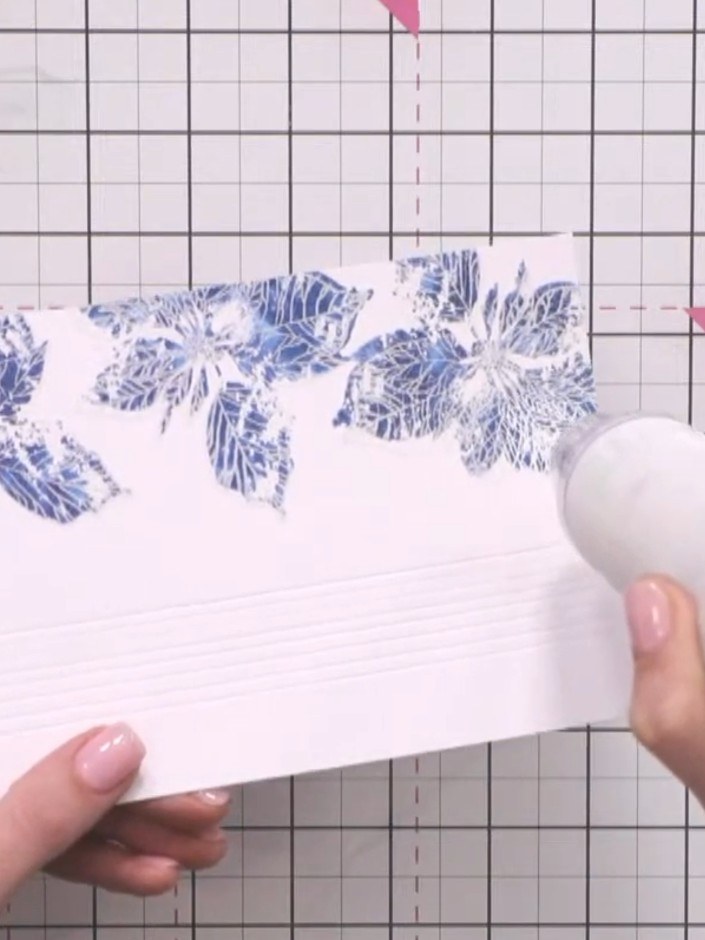 Step 11: Heat set the embossed detail with a heat gun, moving it over the surface until the powder melts and sets compl