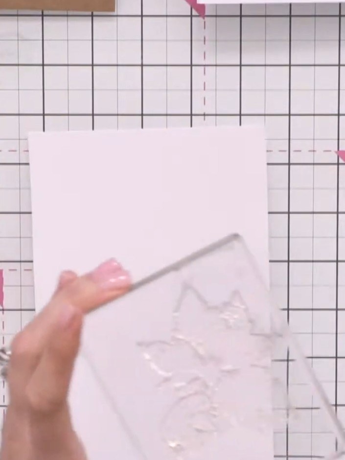 Step 2: Place the solid poinsettia stamp from the lamination stamp set onto your acrylic block and ink it up with teal