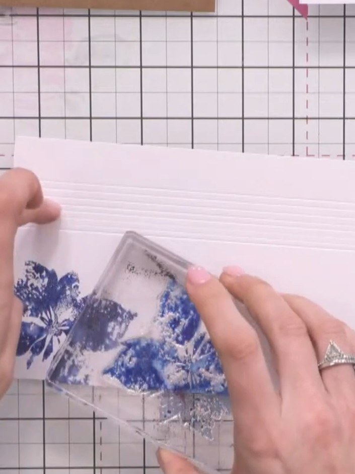 Step 5: Position the butterfly stamps at varying angles on the card front to create visual interest. Stamp additional 
