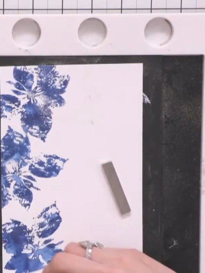Step 8: Ink up the outline portion of the poinsettia stamp from the Merry and Bright lamination stamp set using a whit