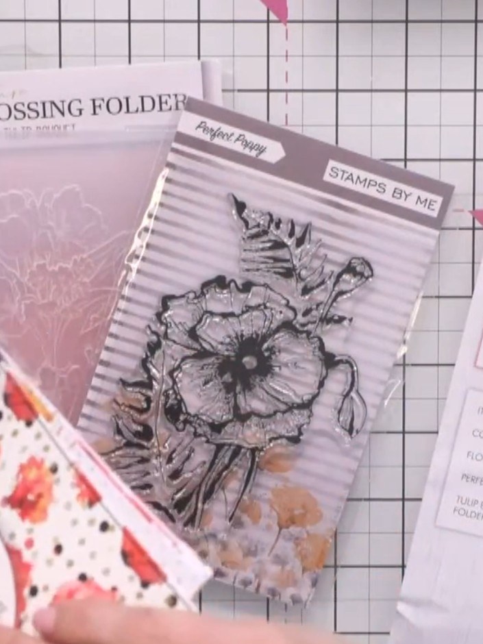 Step 1: Run the floral bouquet embossing folder through your die-cutting machine with black cardstock to create an emb