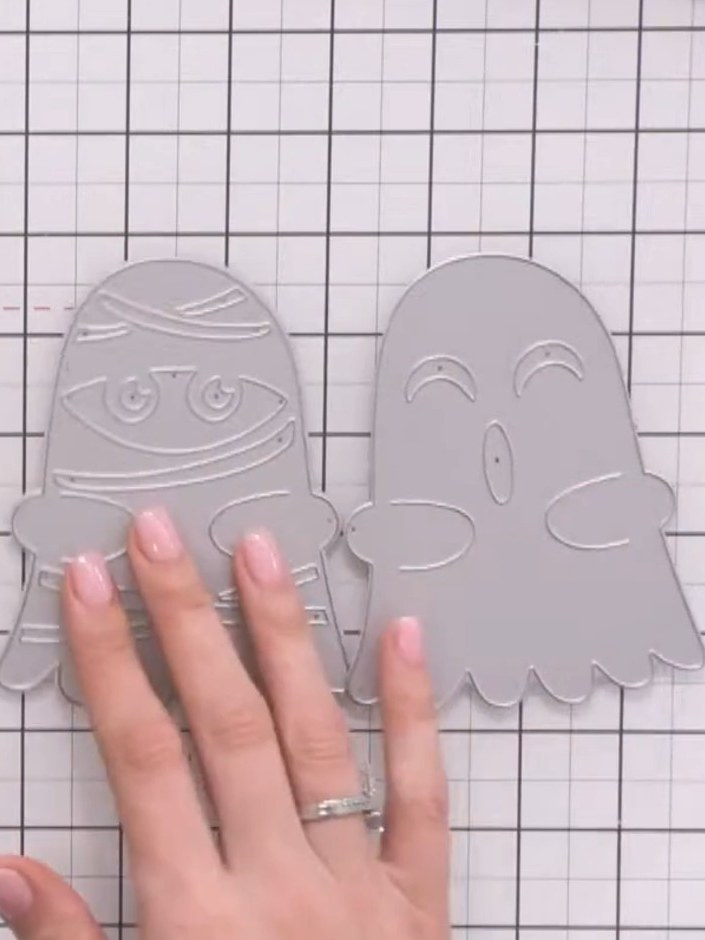 Step 1: Die-cut two ghost character pieces from white cardstock using the outline die from the Jasper, Matilda & Luna 