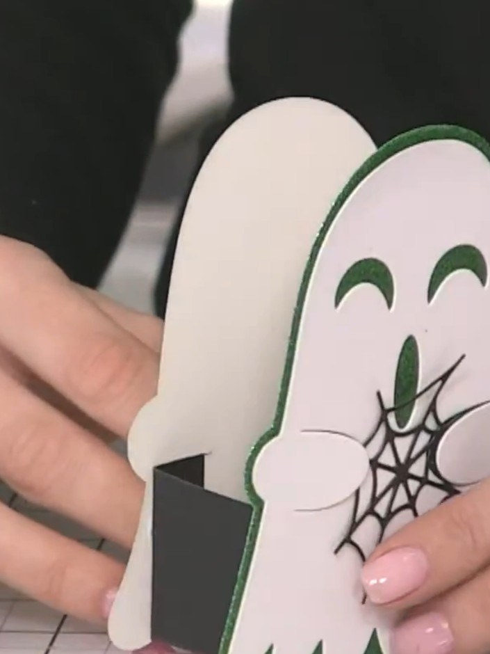 Step 13: Fill the completed ghost treat box with small sweets, treats or gifts. Display your finished ghost box on a ta