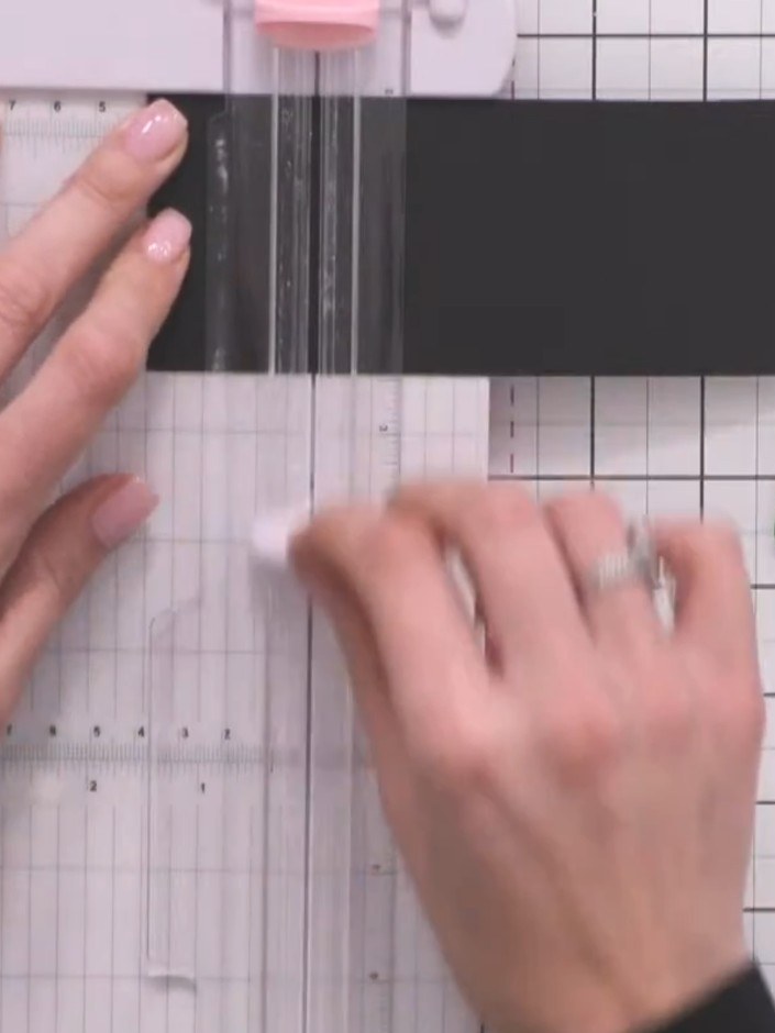Step 3: Place the black card on your scoreboard with the left edge aligned at 1.5 inches. Use your score tool to score