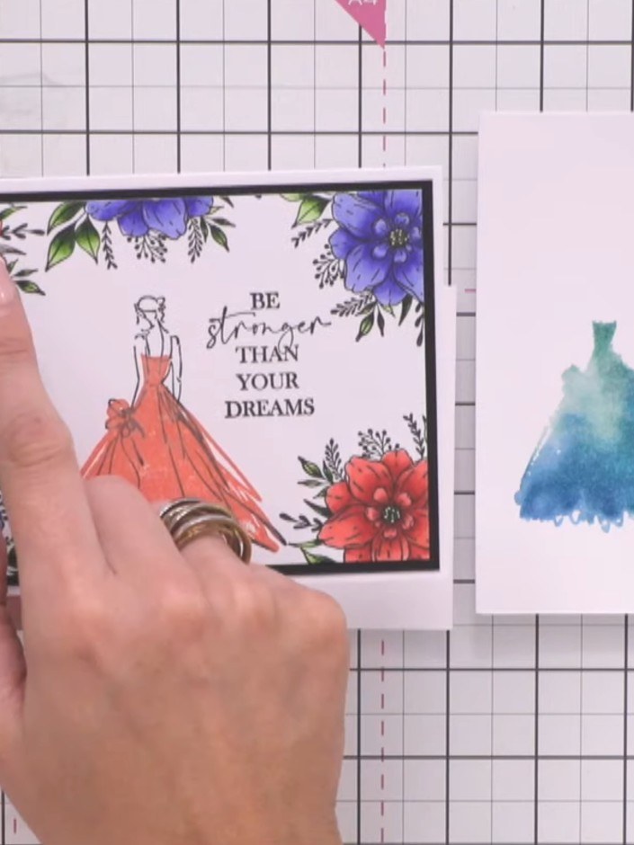 Step 8: Line up the bodice of the outline stamp with the top of the coloured gown and stamp it down carefully to compl
