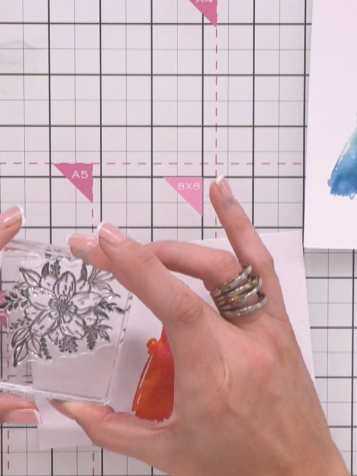 Step 9: Using a blending brush, apply coordinating ink around the edges of the mounted floral stamp to create a soft h