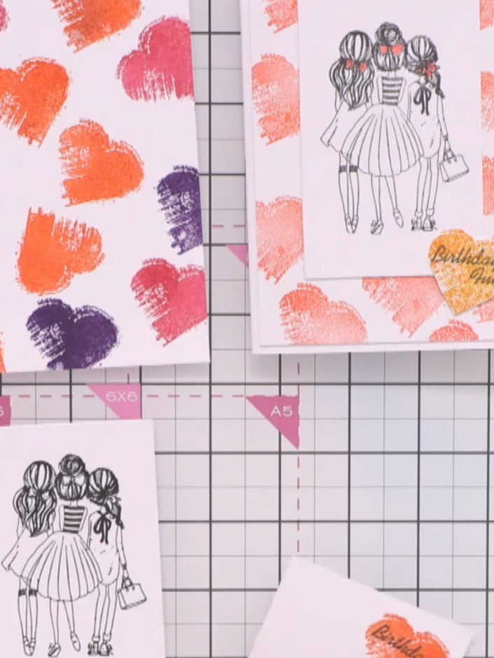 Step 11: Mount the girls silhouette onto the multicoloured heart background card using adhesive or foam pads for dimens