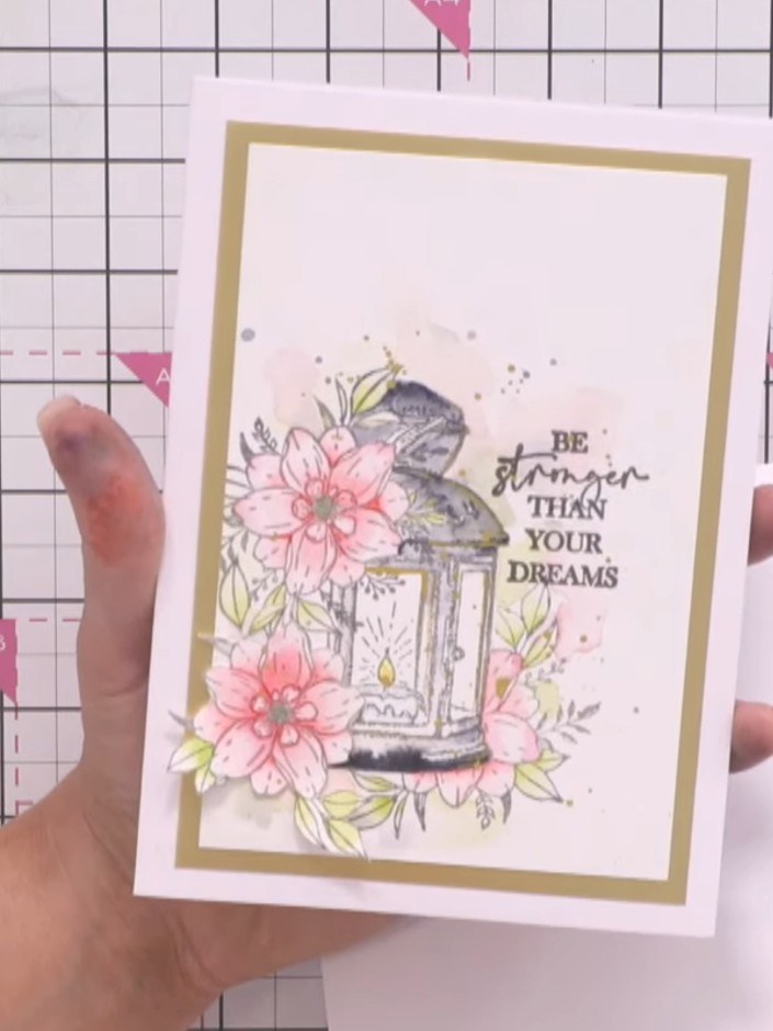 Step 1: Prepare a white card blank measuring approximately 4 by 6 inches. Mount it onto a gold card layer to create a 