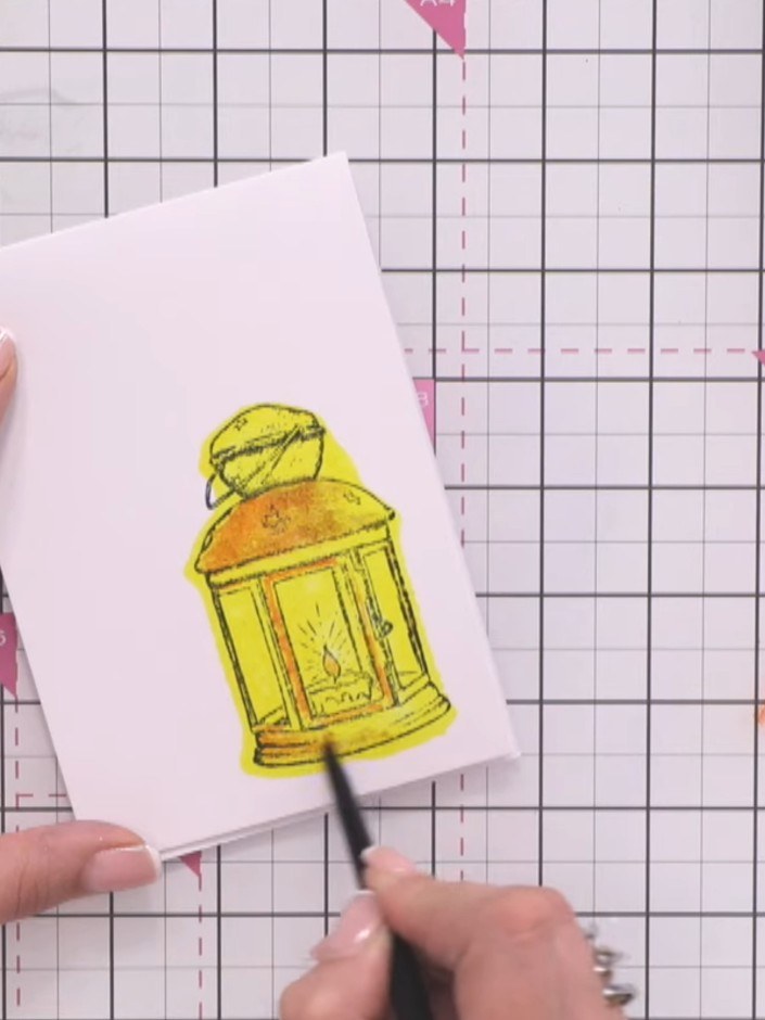 Step 11: Mount the coloured lantern panel onto your card blank using adhesive. Position it centrally on the card front 