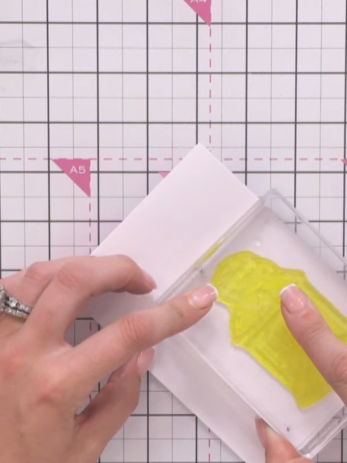 Step 2: Turn the lantern stamp around so the back (solid portion) faces up. Position it on your white card ready to st