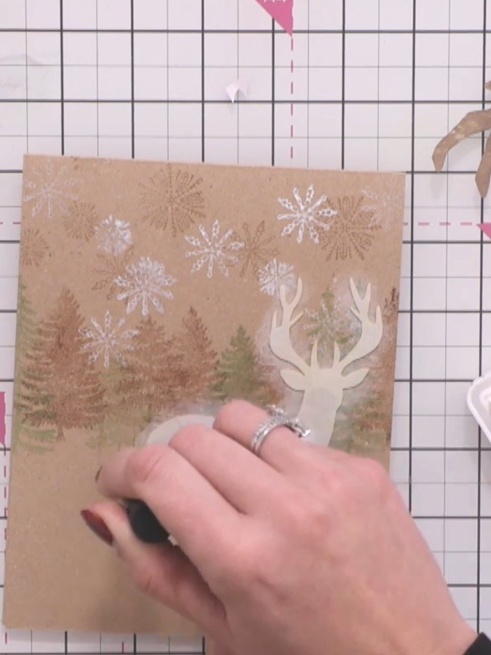 Step 11: Gently blend the white ink outwards with your finger using soft circular motions to create a soft, glowing hal