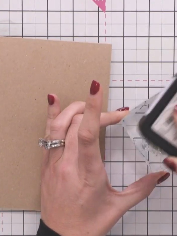 Step 2: Ink a tree stamp with vintage photo Distress Ink and stamp it onto the kraft card to create the first tree in 