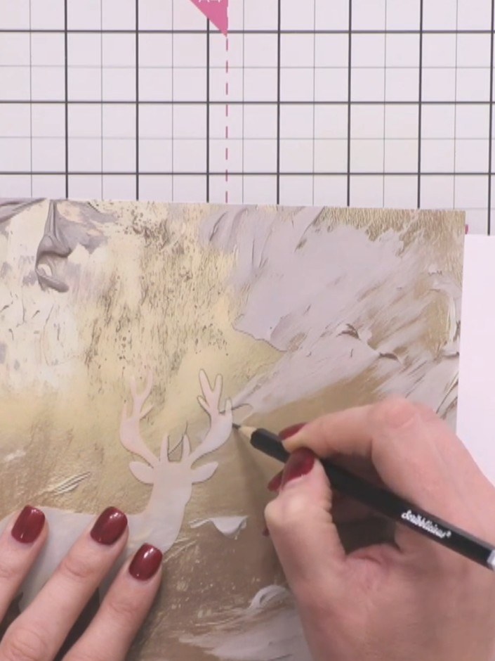 Step 9: Carefully cut out the stag shape using scissors, roughing up the edges slightly with the pen for a vintage, di