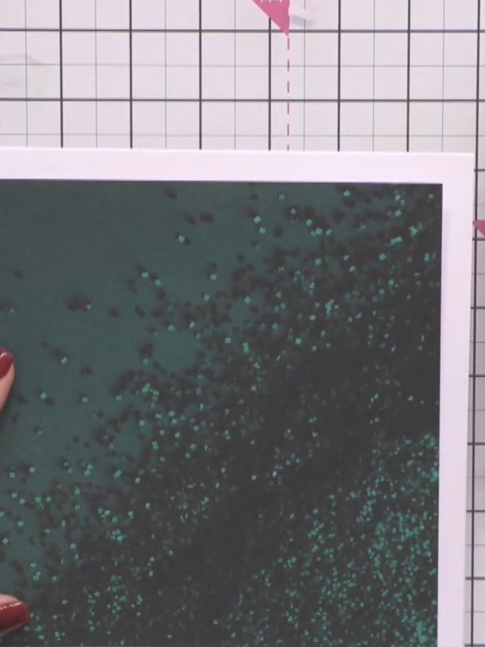 Step 1: Select an 8x8 green sparkle card base from your kit. Gather the winter cabin scene patterned papers and place 