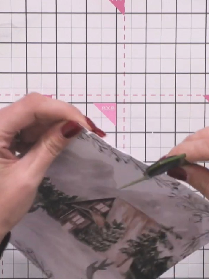Step 7: Trim the patterned paper with scissors to create a vintage-style edge. Apply distress ink around the perimeter