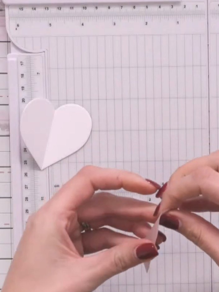Step 4: Fold the vellum heart pieces in half yourself by hand to avoid cutting through the delicate material with the 