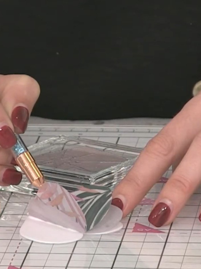 Step 7: Use an acrylic block to gently flatten the layered vellum pieces whilst maintaining the 3D effect. Hold the bl