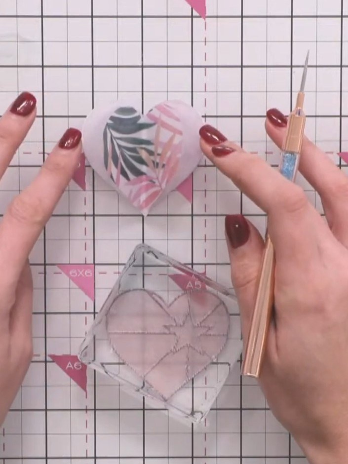 Step 8: Repeat the process with the medium and small heart shapes, layering vellum pieces with different patterns. Var