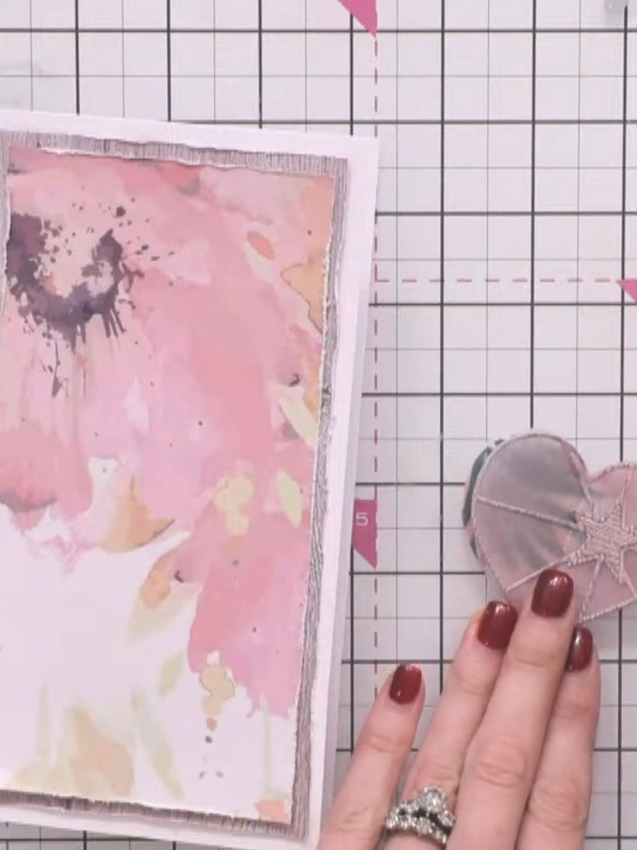 Step 5: Position the clear vellum heart stamp over the pink watercolour panel and place it to one side. Take additiona