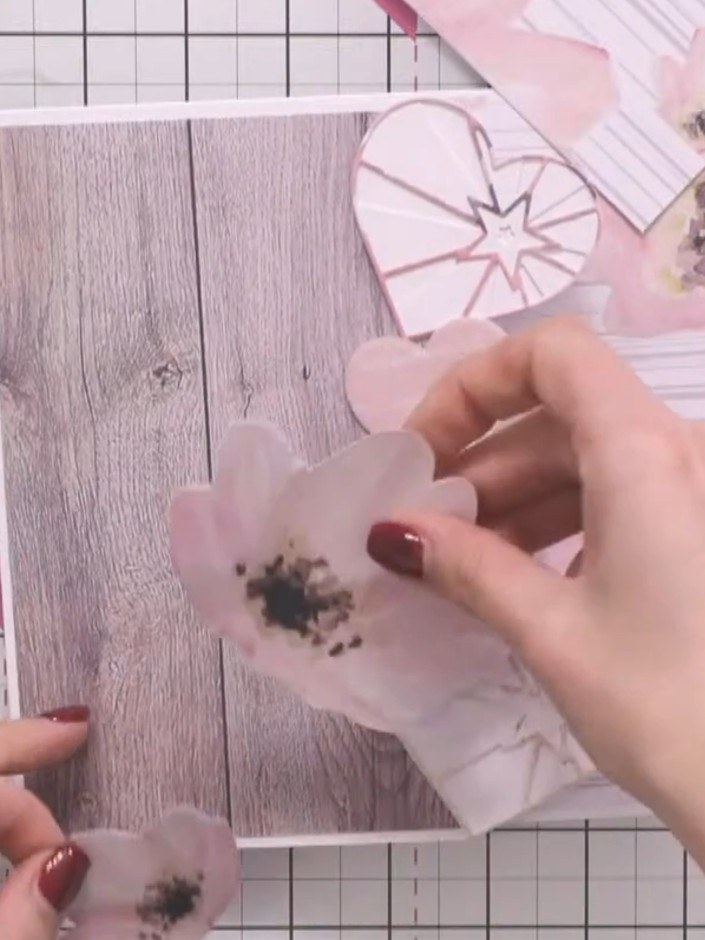 Step 3: Arrange the fussy-cut flowers on your wood-effect card base to create a pleasing focal point. Position the lar
