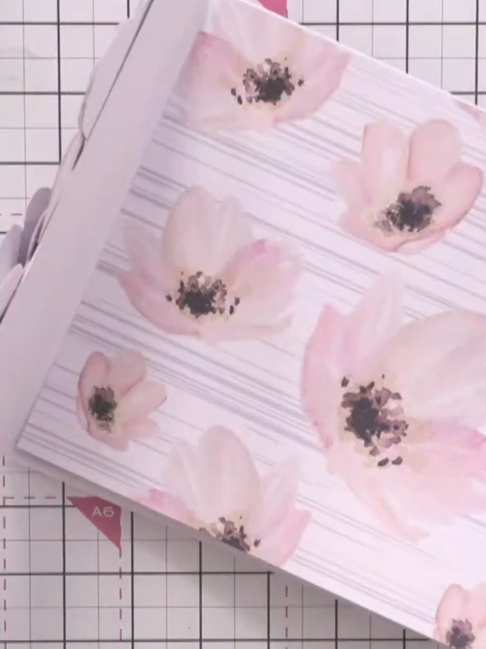 Step 9: Add additional heart die-cuts or other decorative elements to complete your design. Position them around the f