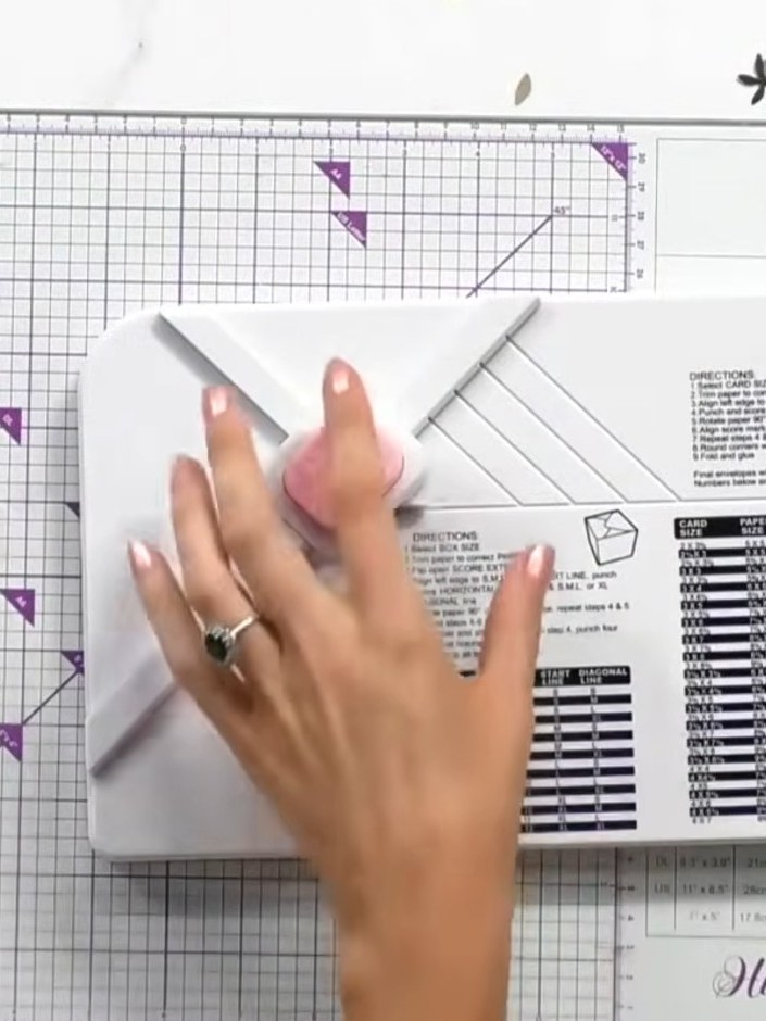 Step 1: Place your 12x12 inch patterned paper into the Hunkydory box board, aligning it at the XL start line marked on