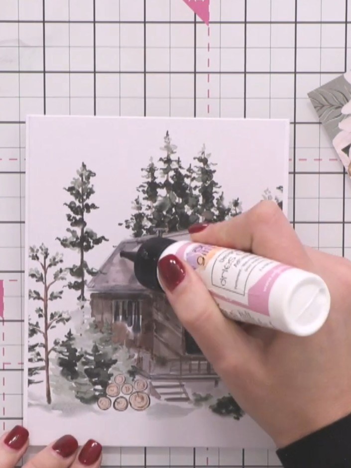 Step 4: Apply clear-drying glue to the roof of the cabin image. Whilst the glue is still wet, sprinkle colourless glit