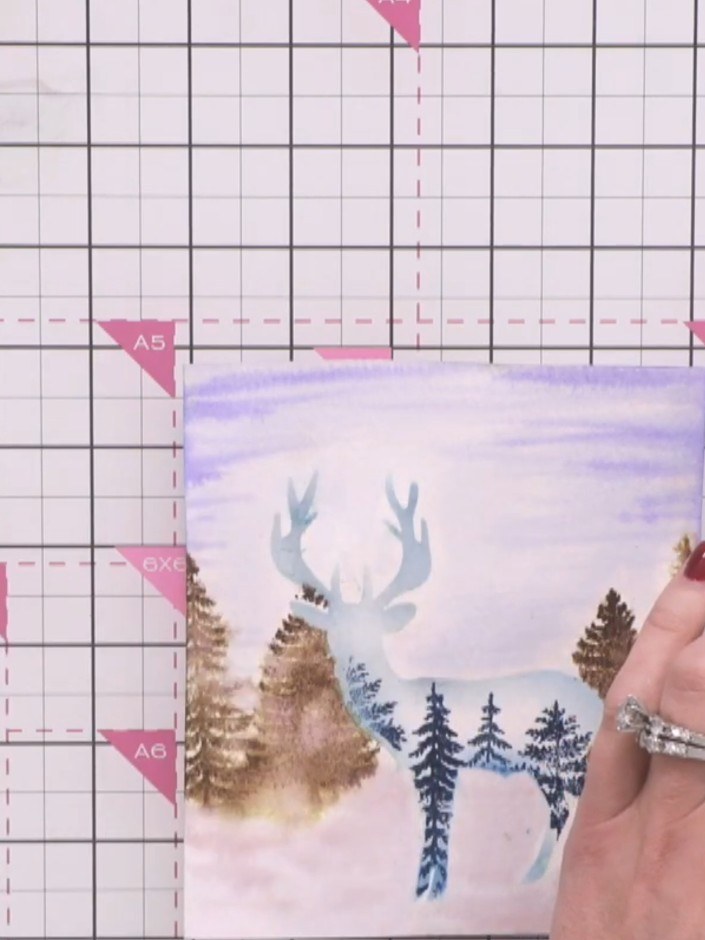 Step 12: Stamp the tree images again using green ink to restore the definition and details that were softened during th