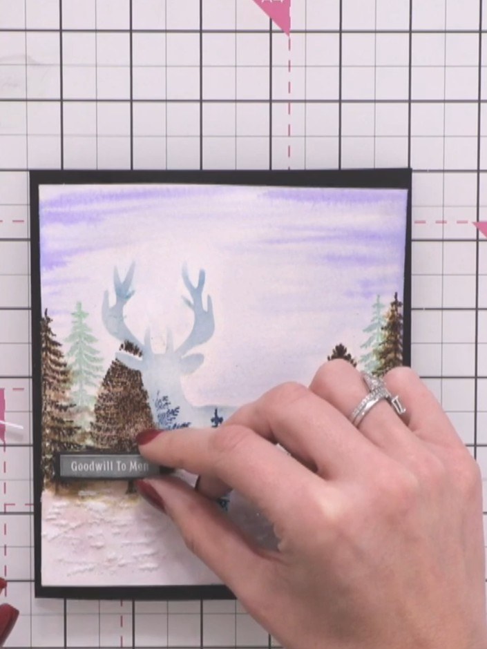 Step 13: Cut a sentiment from the washi set and mat it onto black card. Position the matted sentiment on the lower port