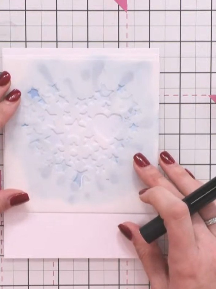 Step 5: Apply purple ink through both stencils layered together, pressing firmly to ensure the colour reaches through 