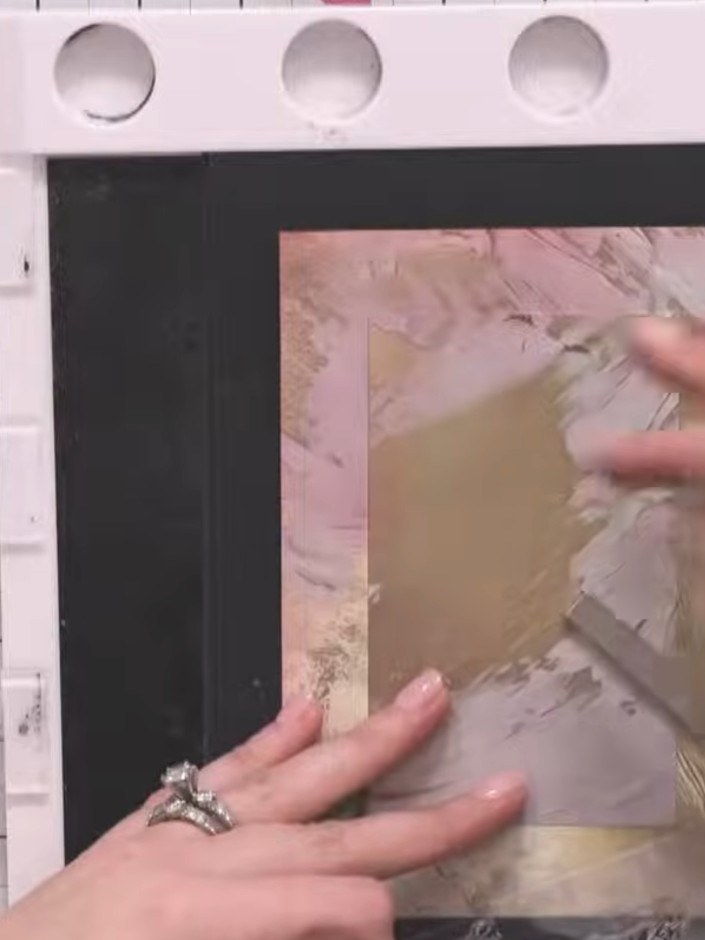 Step 4: Stamp the cotton flower design in one corner of your cream card using the stamp and sticky ink pad. Press firm