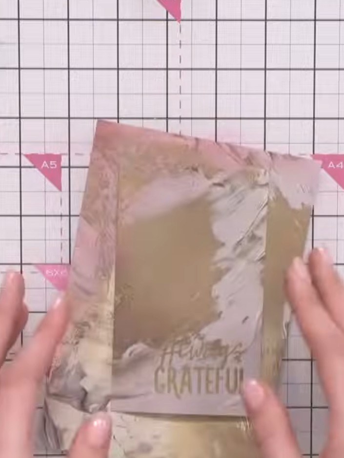 Step 9: Stamp the 'Always Grateful' sentiment in black ink at the base of the card. Position it centrally at the botto