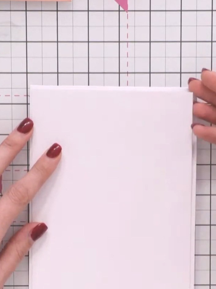 Step 1: Start with a white top-folding note card measuring 5 by 7 inches. Cut a slightly smaller piece of white cardst
