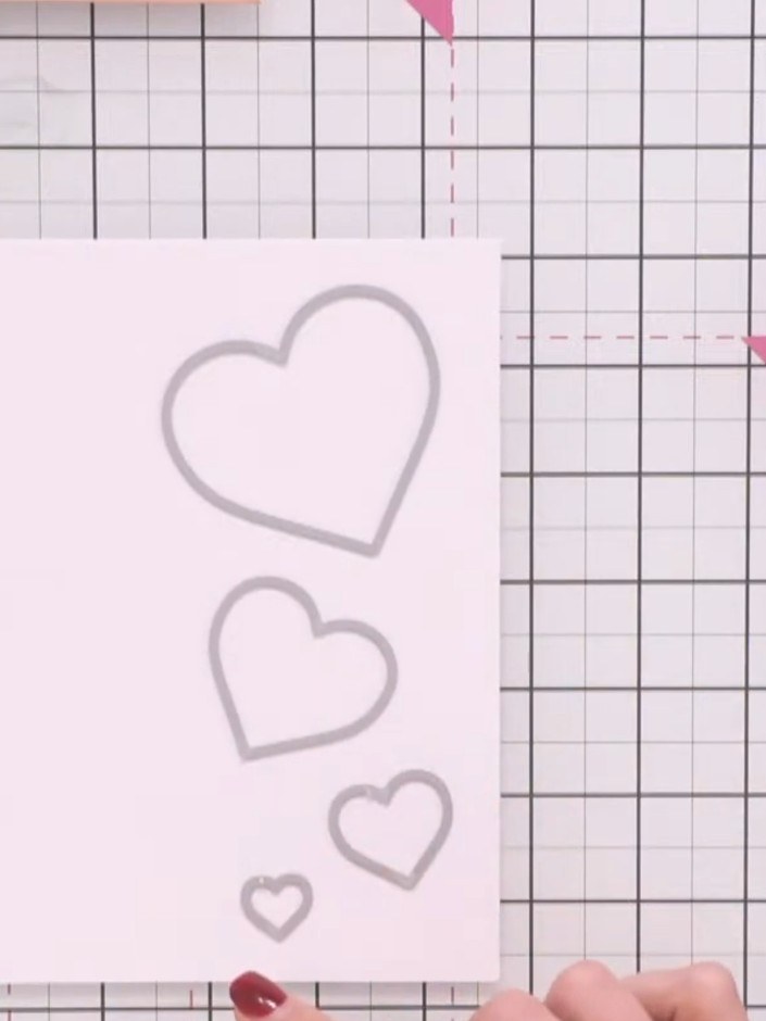 Step 3: Die-cut the next size down heart from rose gold glitter cardstock and layer it on top of the first heart on yo