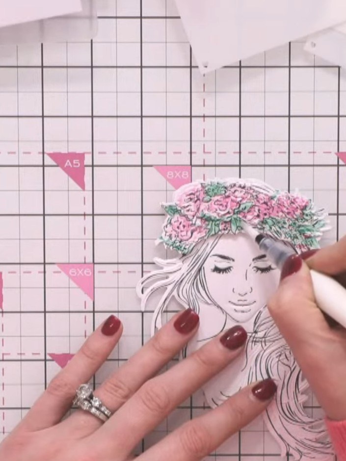 Step 10: Add sparkle to the finished portrait using a sparkle pen to enhance details on the hair, face and floral crown