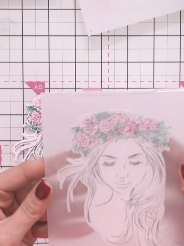 Step 7: Run both die cut shapes through the 3D embossing folder, carefully lining up the eyelashes to ensure correct p