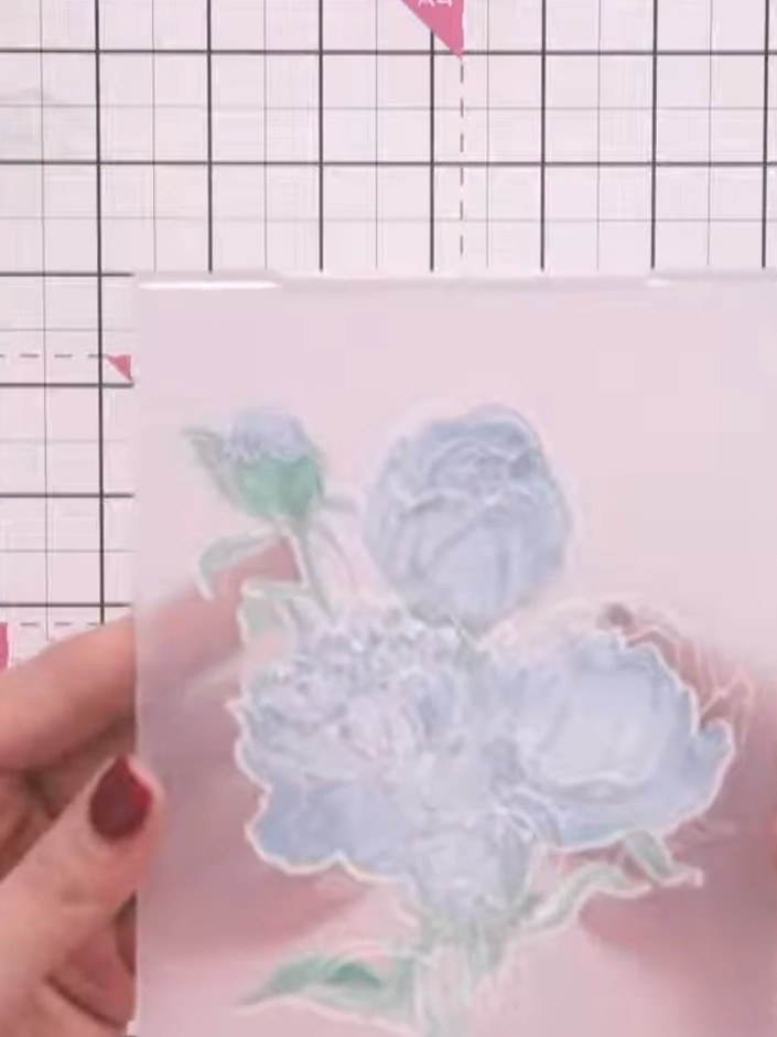 Step 10: Run the embossing folder with the flower design through your die-cutting machine to create dimensional detail 