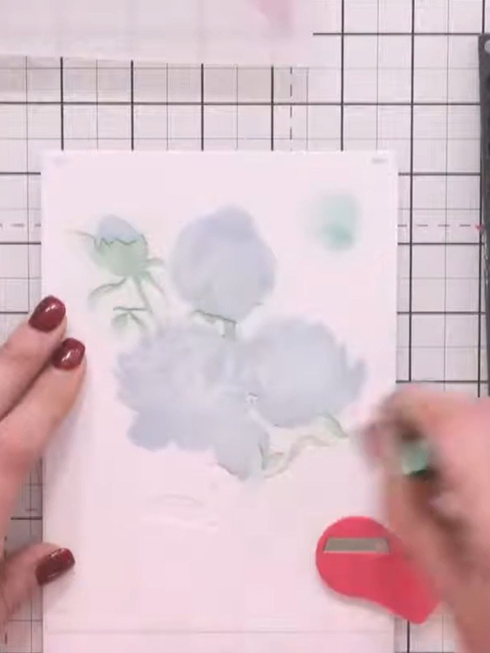 Step 5: Apply the fourth and final layering stencil (numbered 4) over the design. Use the same green ink pad to add co