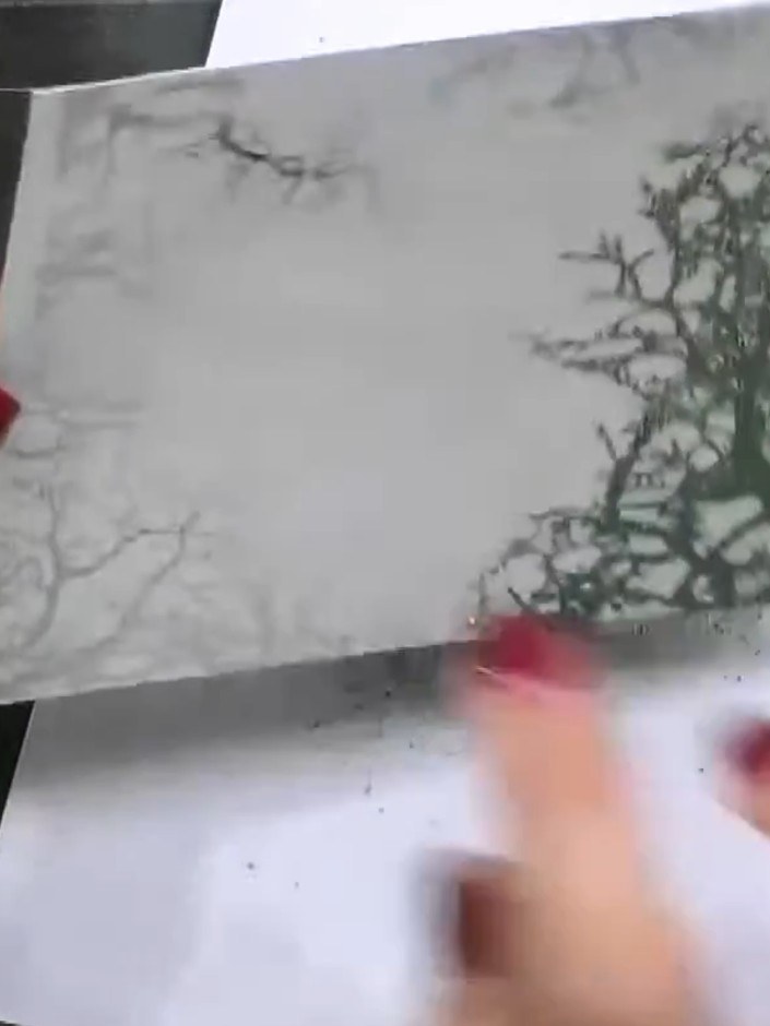 Step 3: Dust the stamped tree image with forest green and gold embossing powder, ensuring the entire stamped area is f