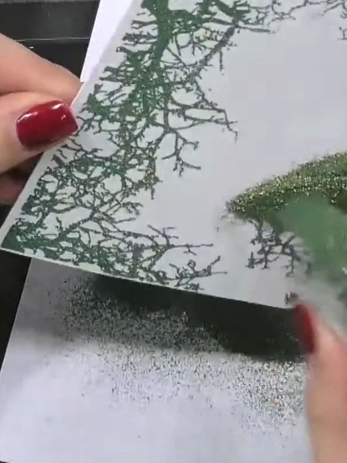 Step 4: Heat the embossed image with a heat gun to melt the embossing powder and set the design. Move the heat gun con