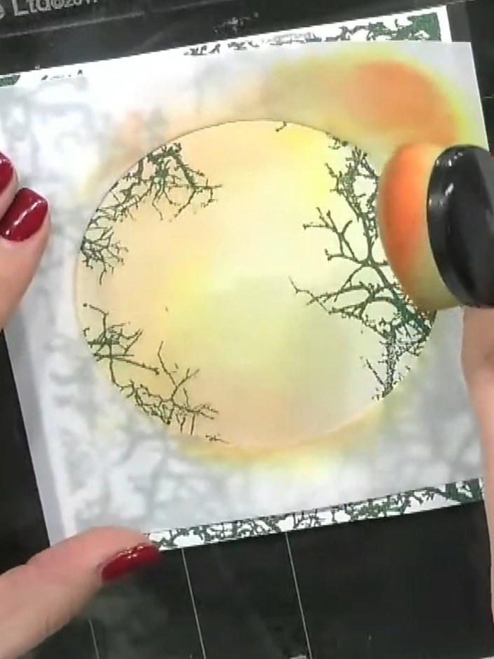 Step 7: Add a touch of pink or red ink to the upper right area to create a gradient effect. Work from the stencil edge