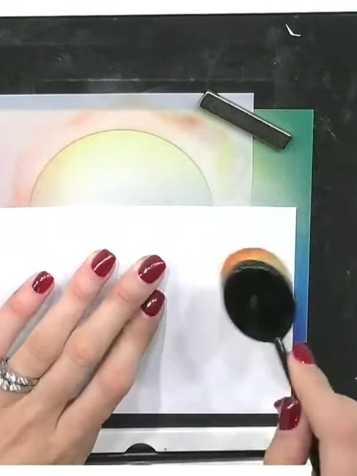 Step 1: Position your circular stencil on the gradient card to mask the area where the sun will be. Place it in the up