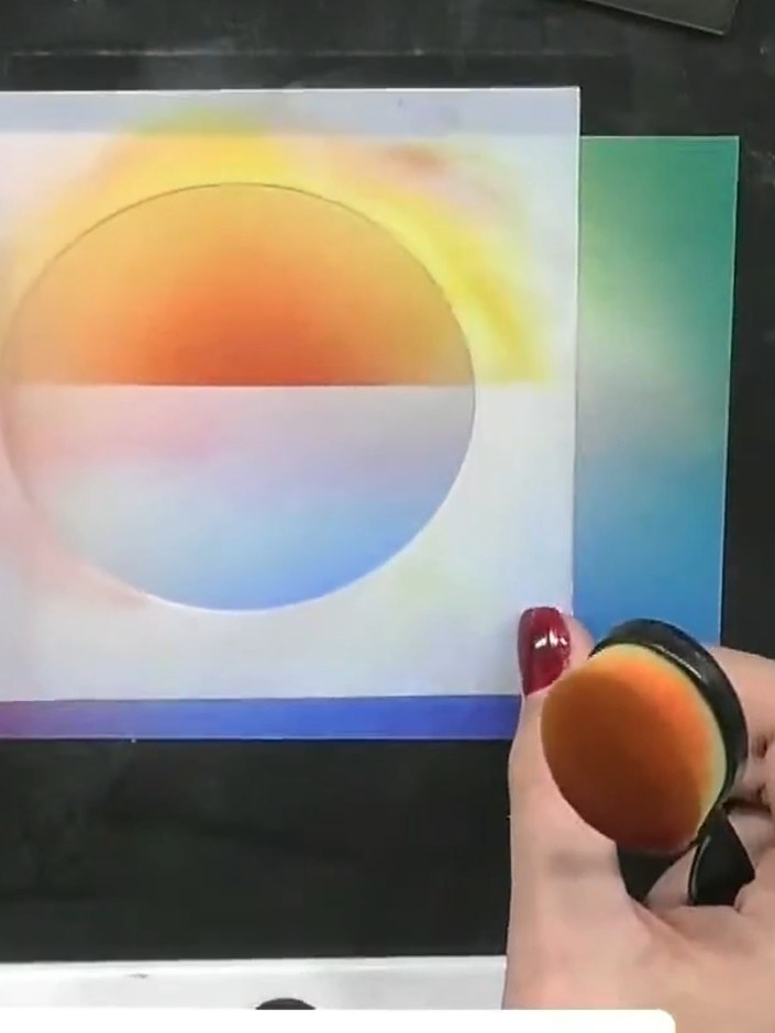 Step 6: Use an ink blending tool to apply orange ink along a horizontal line across the centre of the card to create a