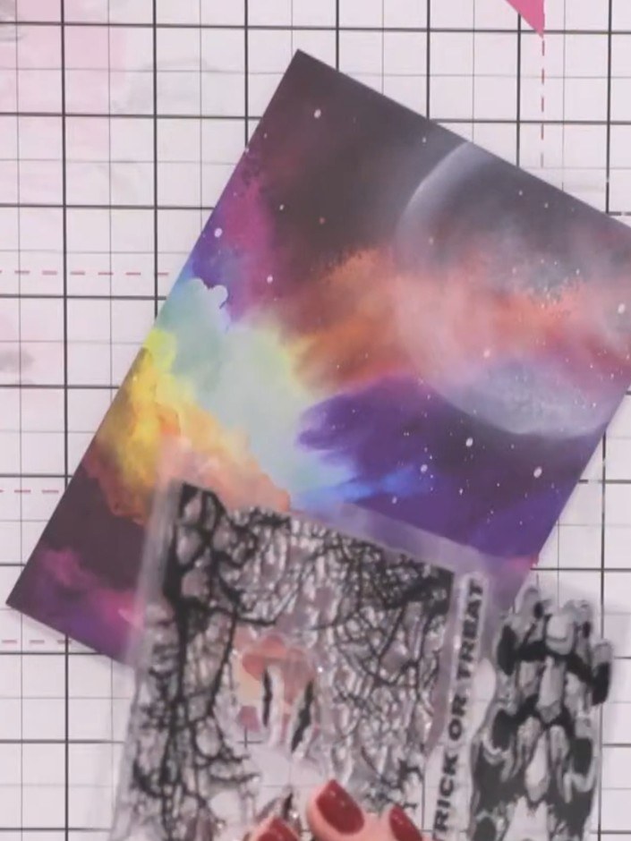 Step 3: Stamp the silhouette children figures at the base of the card, positioning them to create a reflection effect 