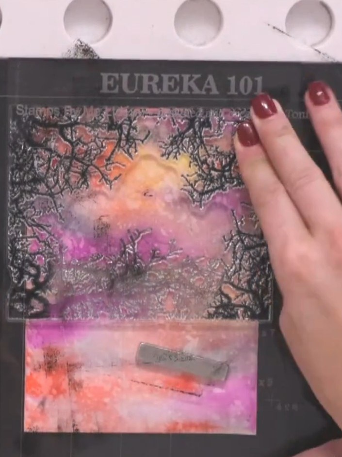 Step 10: Rotate the tree frame stamp and re-stamp around the edges of the watercolour panel to fill in any gaps and cre