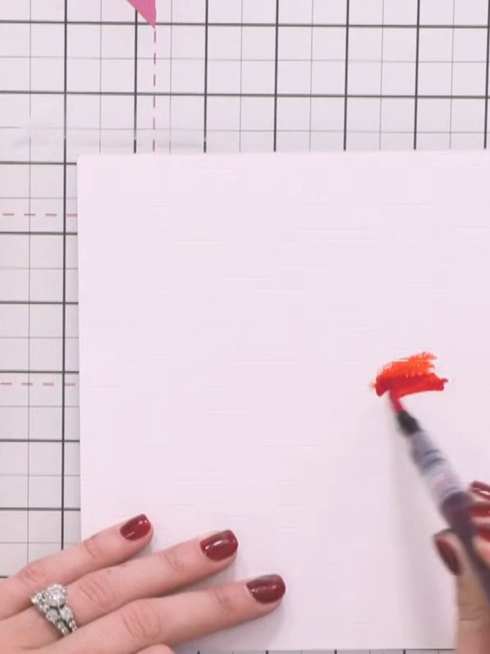 Step 2: Apply your lightest watercolour pen colour directly onto the wet card, allowing the colour to flow and blend n
