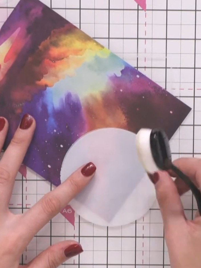 Step 5: Position the circular stencil directly over your stamped moon image, aligning it carefully to match the moon's