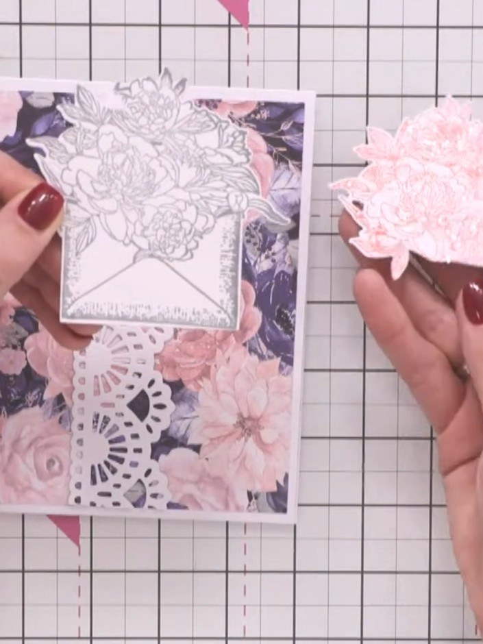 Step 3: Stamp the envelope with the floral design twice—once using grey ink and once using pink ink. Position the stam